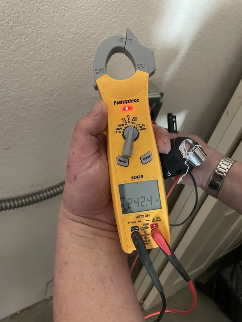 Voltage testing with clamp meter during Generator Installation in Alexandria